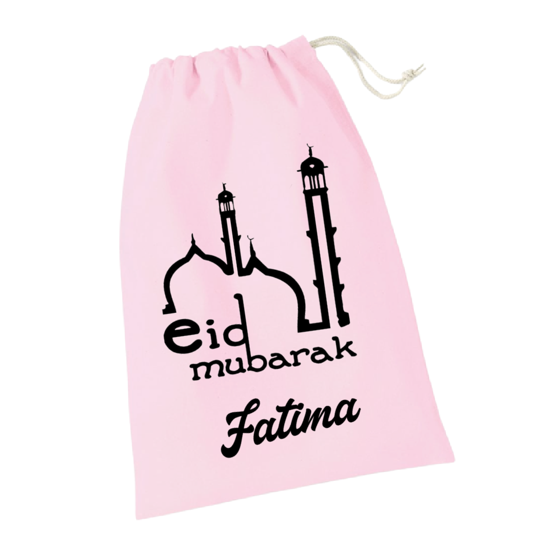 A pink gift sack with 'Eid Mubarak' and two mosque towers printed on it, with the name 'Fatima' below the text.