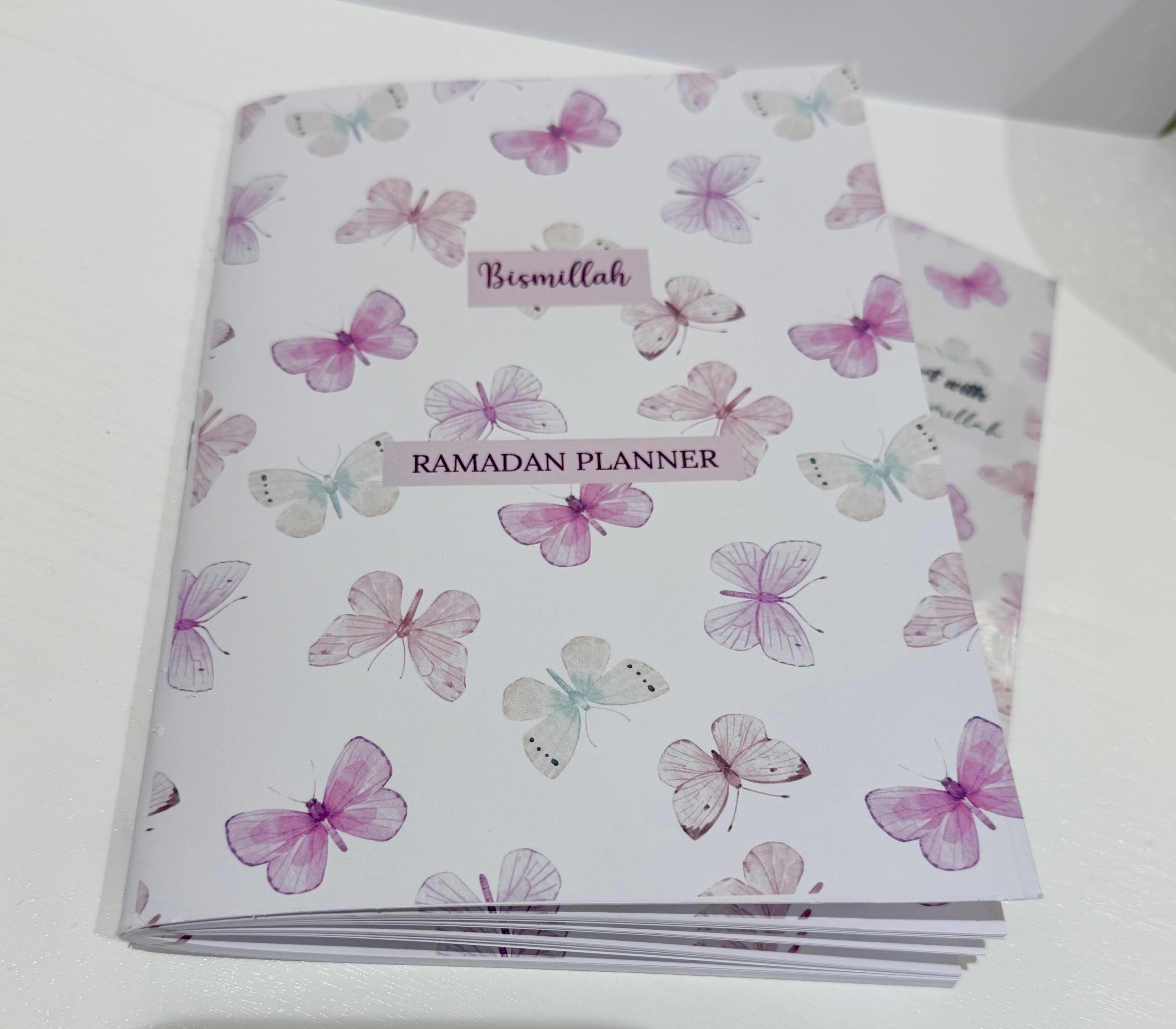 Ramadan planner with butterfly design on a white background